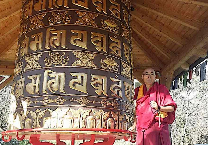 Buddha-Weekly-Geshe Sherab and giant prayer wheel-Buddhism Geshe Sherab turns a giant prayer wheel with millions of mantras for the benefit of all sentient beings.