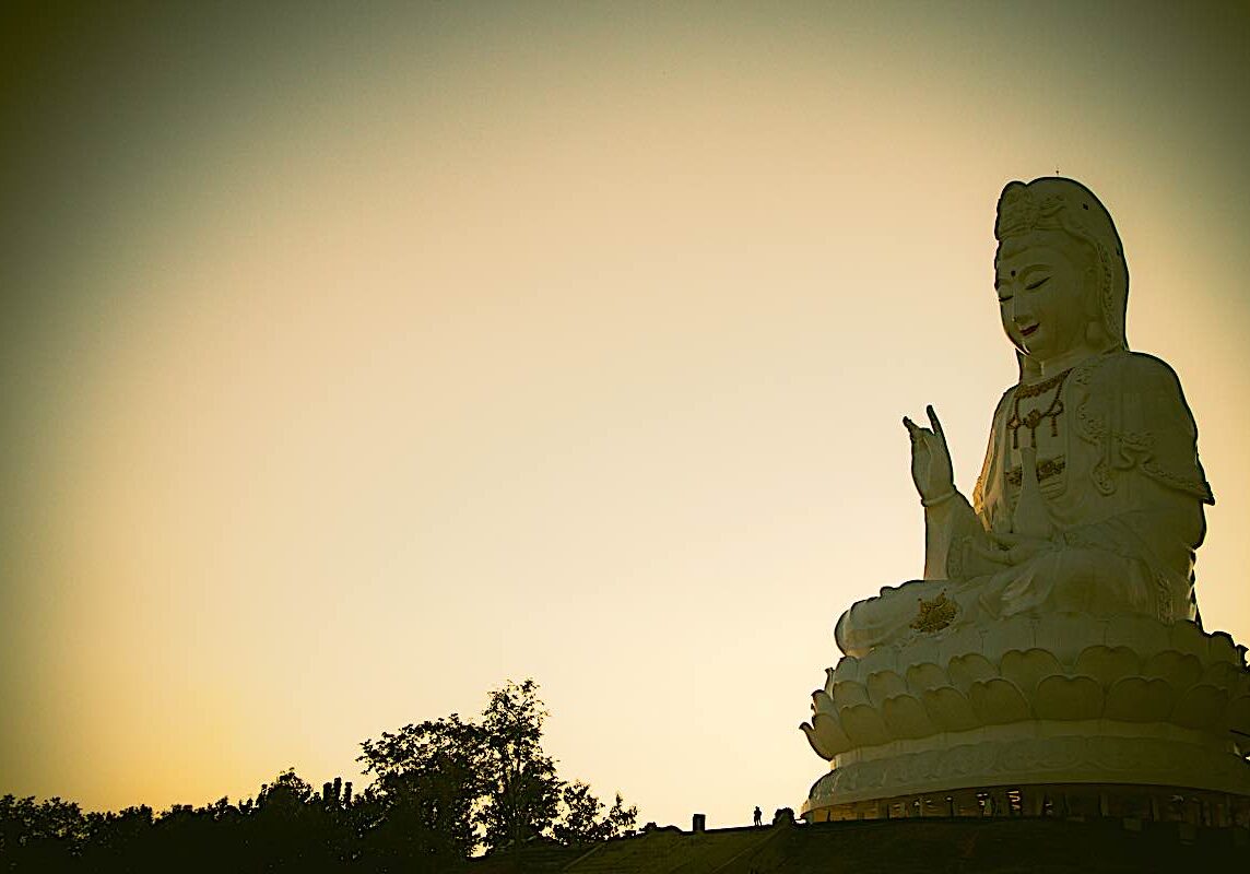 Buddha-Weekly-Mahayana Buddhism Guan Yin dreamstime_xxl_113071020-Buddhism Guan Yin Bodhisattva. The main defining characteristic of Mahayana Buddhism is "loving kindness" and compassion for all beings, symbolized in the great ideal of the Bodhisattva — an Enlightened Being who remains in our relative reality world to help us, rather than moving on to Nirvana's peace.